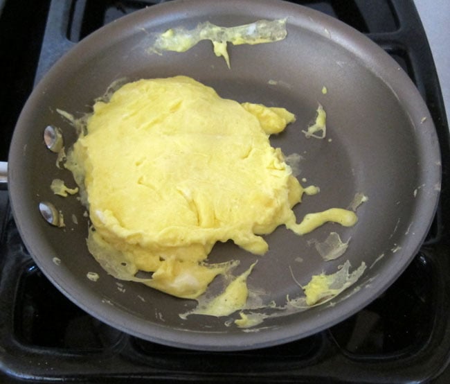 Spring Chick Egg Breakfast Sandwiches Recipe by KidsActivitiesBlog.Com. Step 1 pictured whiked eggs with salt, pepper and heavy whipping cream